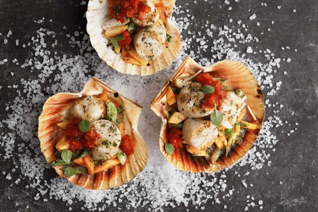 Scallops With Shell Scallops grilled in their shells with papaya and spicy tomato and bell ...